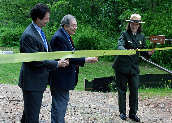 Ribbon-cutting at Earth Day dedication ceremony.  From left: Kevin Levitas, Former Congressman Elliott Levitas, Superintendent Patty Wissinger.