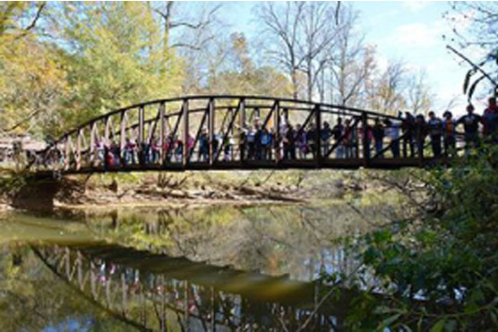 Ticket To Ride participants on Powers Island bridge