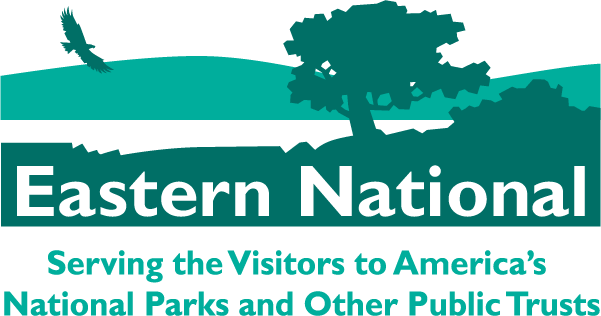 Eastern National Logo Image of an eagle flying over a lake with a mountain in the background and a large tree in the foreground.