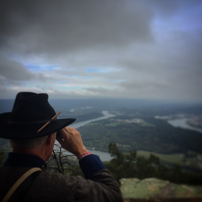 A Living Historian Portraying a Confederate Uses Field Glasses to Look at Moccasin Bend