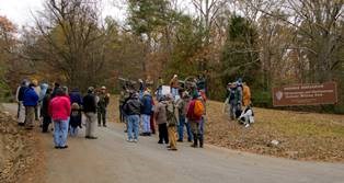 Visitors gather for a ranger-guided tour of Sherman Reservation