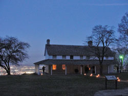 The Cravens House illuminated with Christmas lights