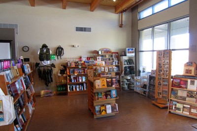 A picture of the WNPA bookstore, including various for sale with a window visible on the right.