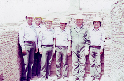 Park preservation personnel standing in a stonework room.