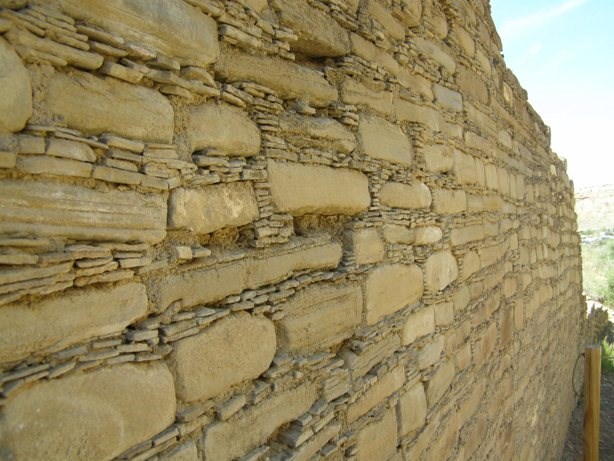 Wall with eroded mortar and missing stones