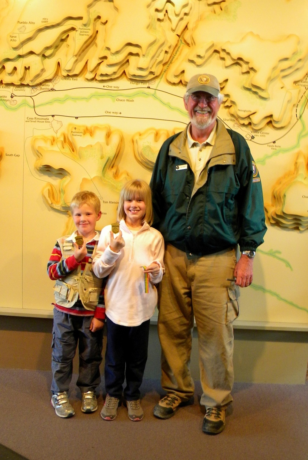 Photo of Junior Rangers Lauren and William Pryor with Park Volunteer Joe Kennedy