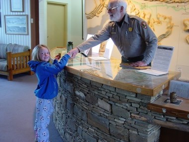 Prairie Bergman gets her Jr. Ranger badge