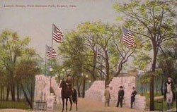 Old color postcard of stone bridge with horseriders