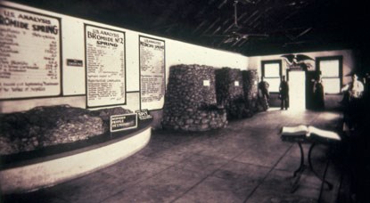 Interior of spring house with stone basins for water