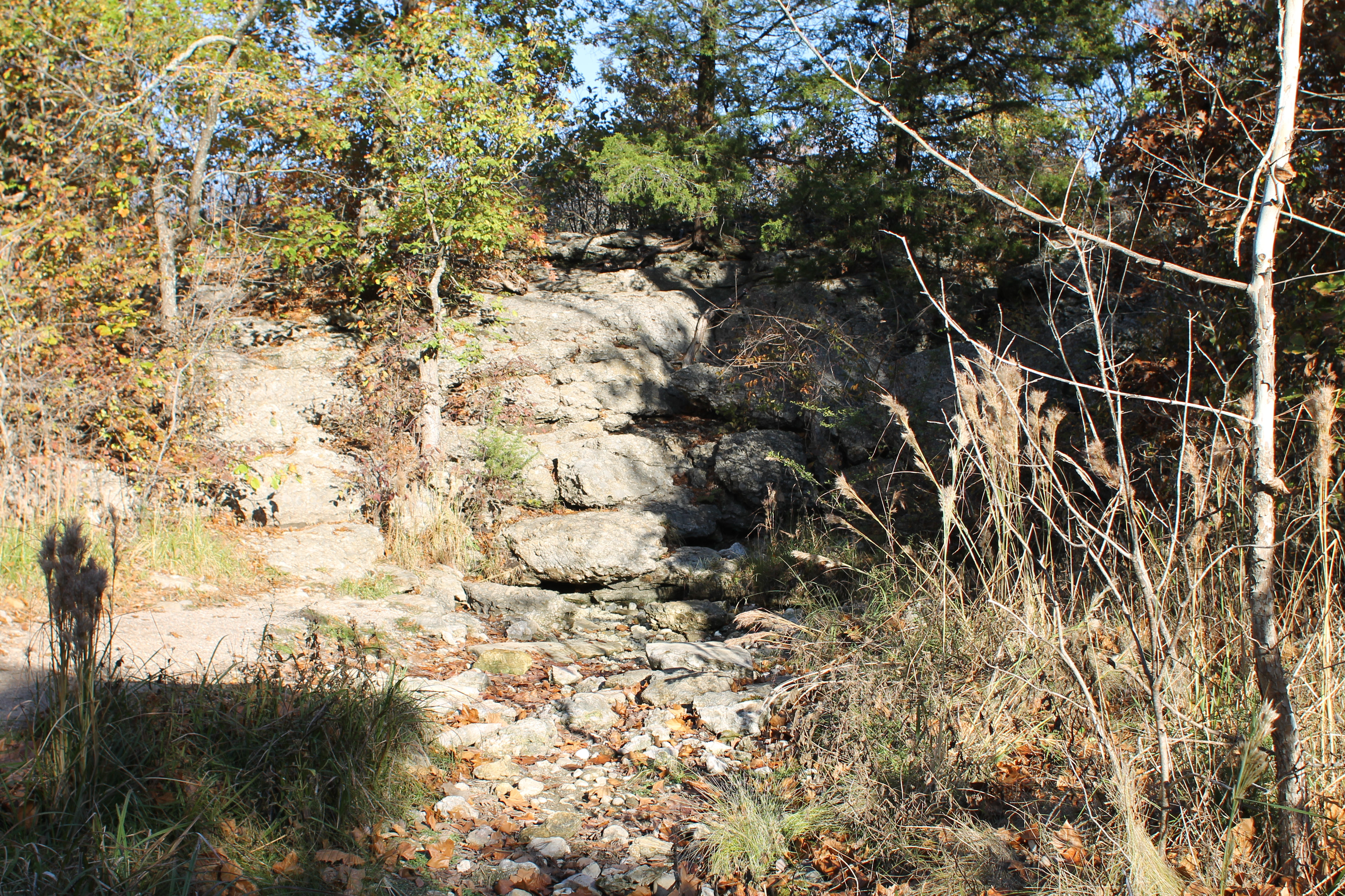 A rocky area with a dry stream bed beneath.