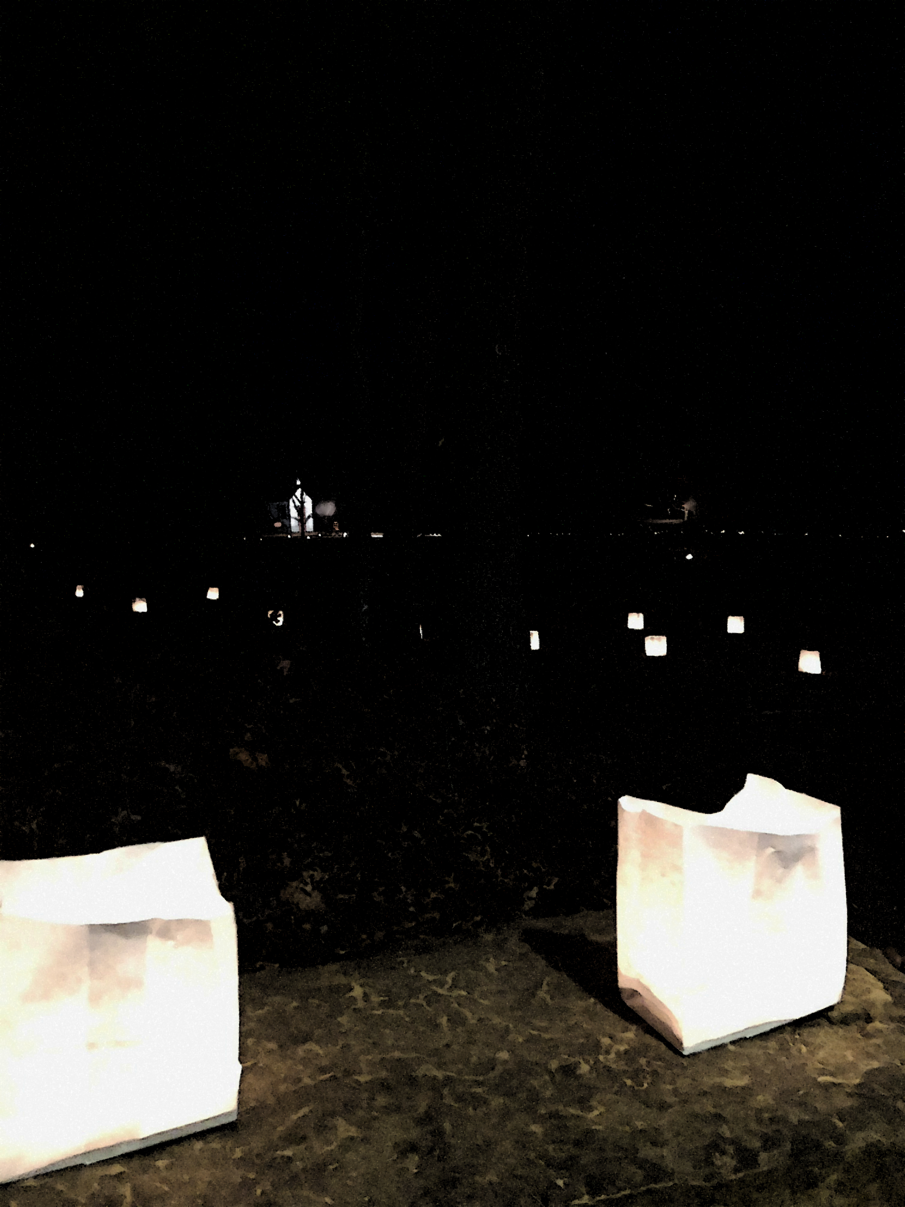 2020 CLT poster background A manipulated photo of luminaries on a dark background, made to resemble artwork.