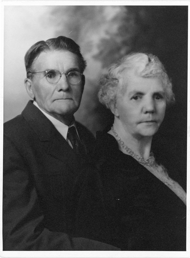 Black and white portrait of older man and woman.