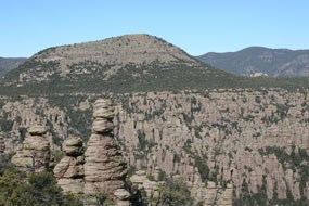 Sugarloaf Mountain rises behind a forest of rock spires.
