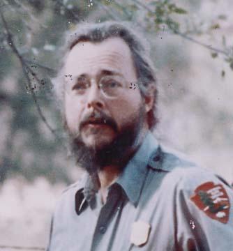 middle aged man with beard wearing glasses