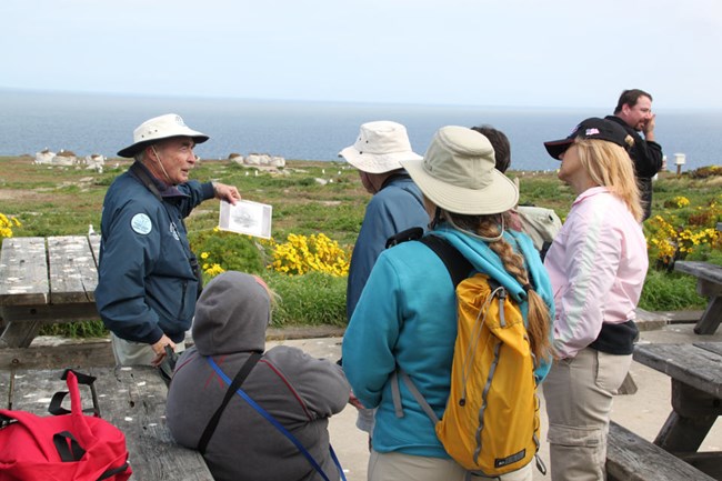 Park volunteer leading hike for visitors.