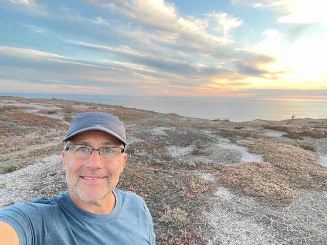 lt= man taking picture of himself overlooking ocean
