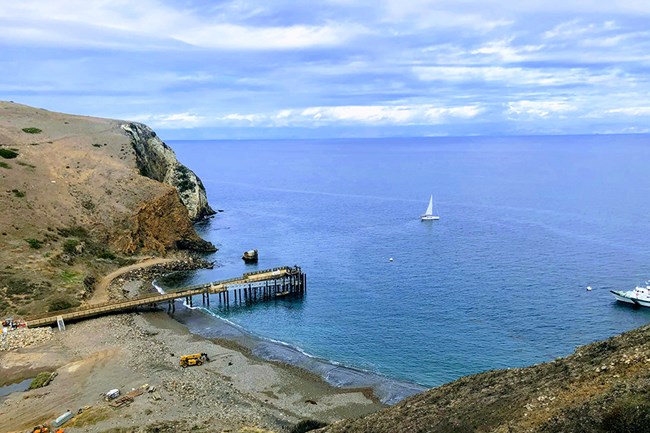 pier in harbor with boats