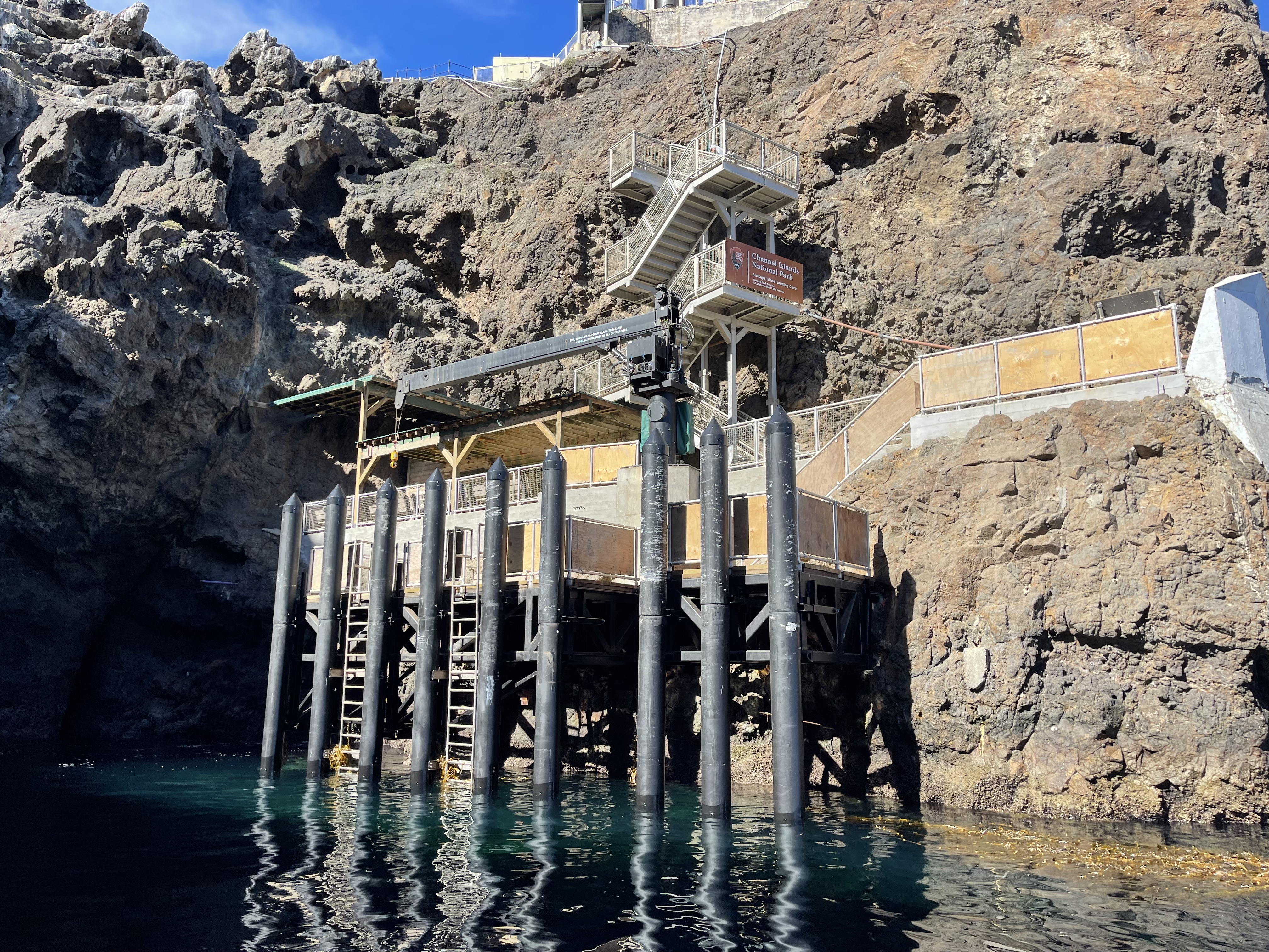 Wood wharf built into cliffside.