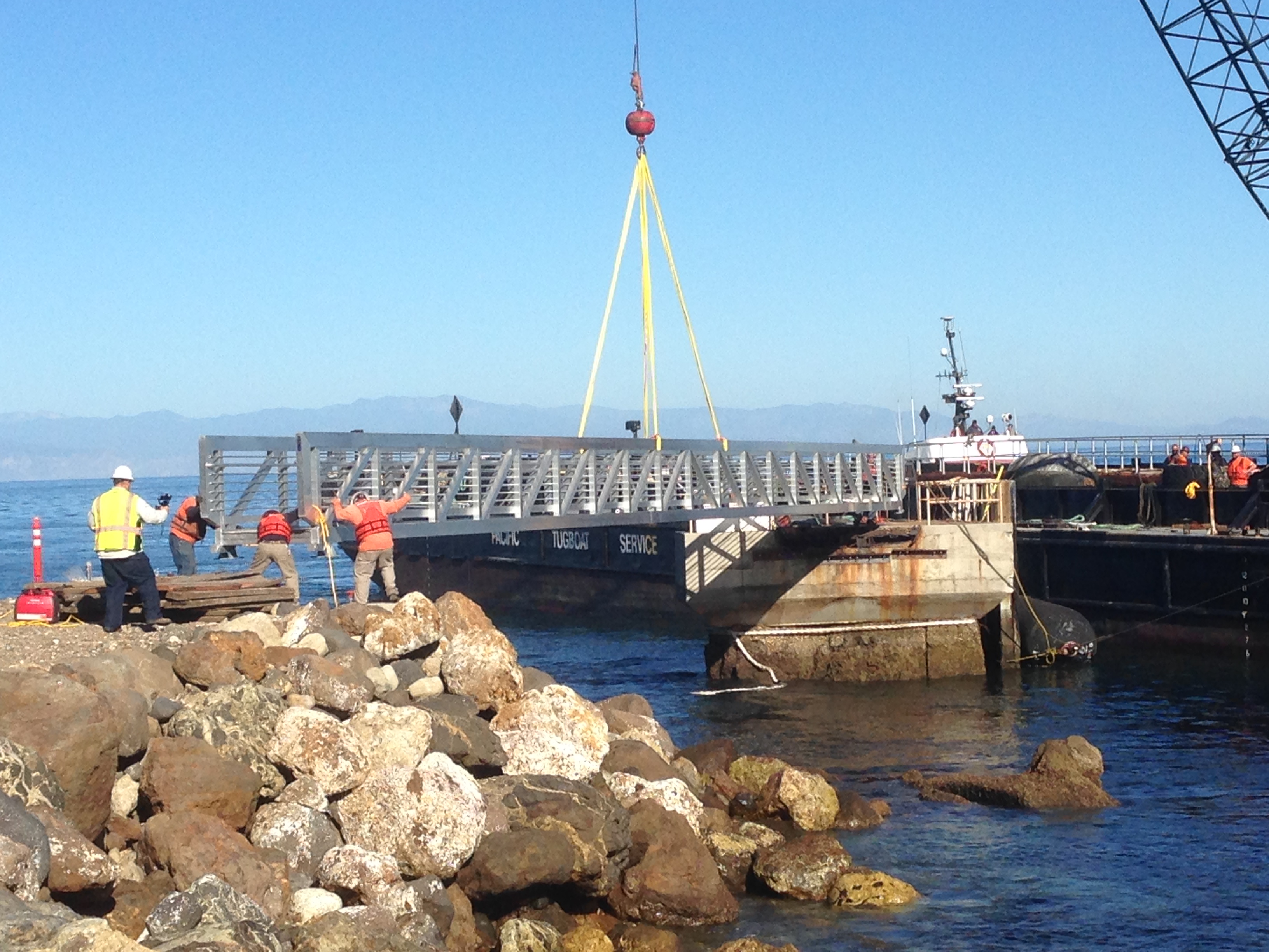 Crane installing new pier.