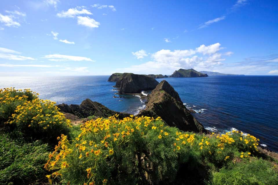 series of islets surrounded by ocean.