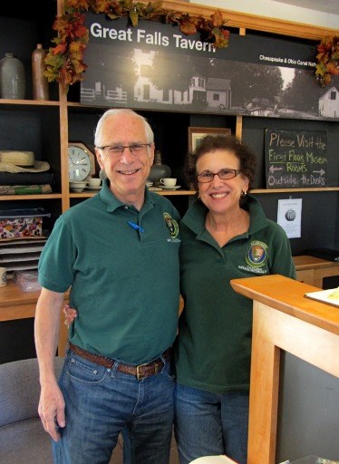 Two employees at the Great Falls Tavern Visitor Center desk Two employees at the Great Falls Tavern Visitor Center desk