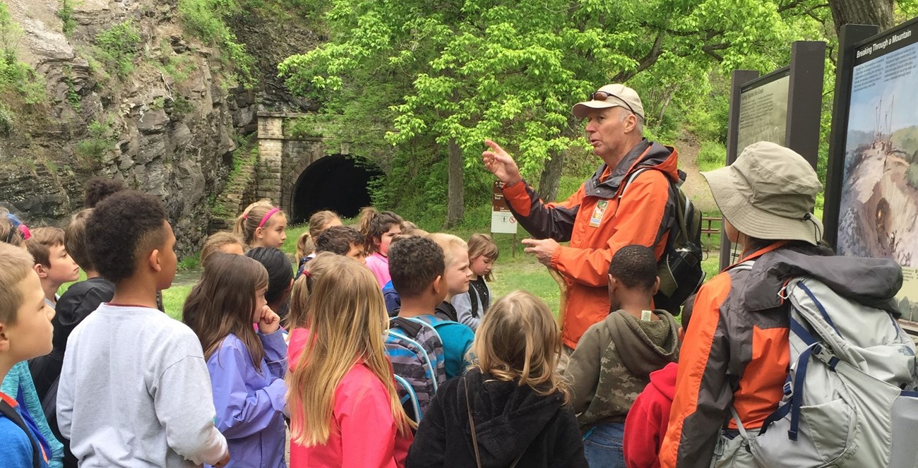 Rangers prepare to lead students through the Paw Paw Tunnel