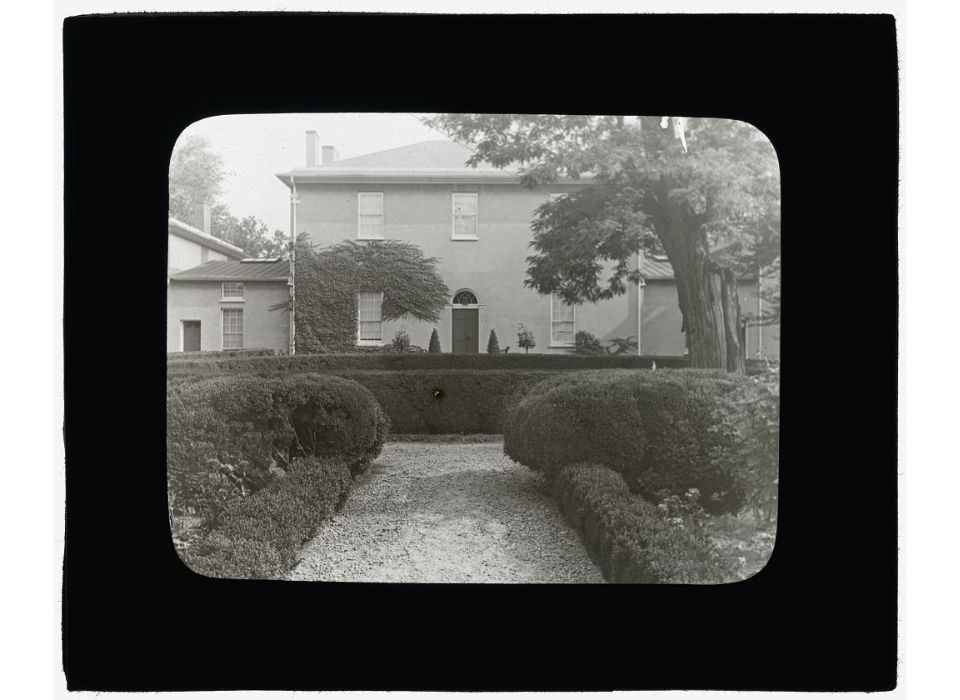 Historical black and white image of the front exterior of Tudor Place in Georgetown, Washington, DC.