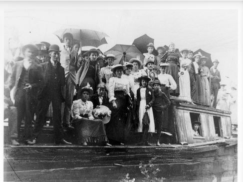 Large crowd of people on a canal boat