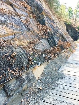 Rockfall mesh to prevent future rockslides.