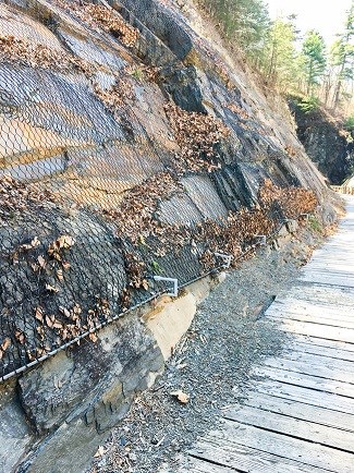 Rockfall mesh to prevent future rockslides.