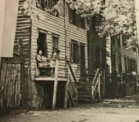 Black and white photo of row houses on Dumbarton Street in Georgetown.