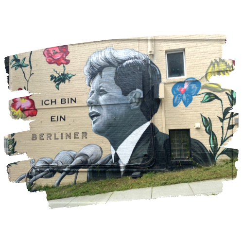 Exterior building mural of JFK with famous quote, "Ich bin ein Berliner."
