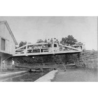 Historical black and white image of Lock 46 and the mule crossover bridge.