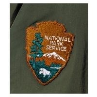 Close up of a park ranger's NPS patch on coat.