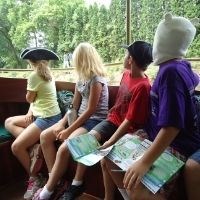 Seated youth observing their surroundings.
