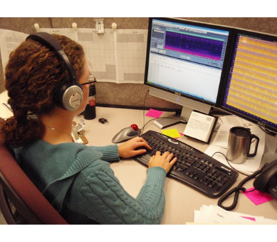 An acoustic technician analyzes a spectrogram of natural sounds gathered from a National Park location.