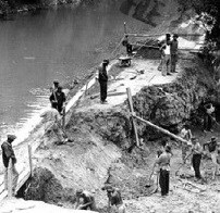 Men of the Civilian Conservation Corps repair a break in C&O Canal towpath.