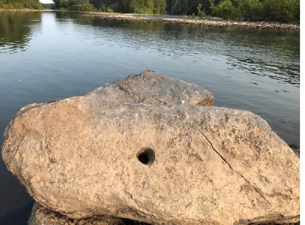 Limestone boulder with pothole