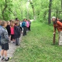 Youth group on towpath learning about mileposts.