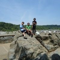 Youth sitting on rock at Great Falls.