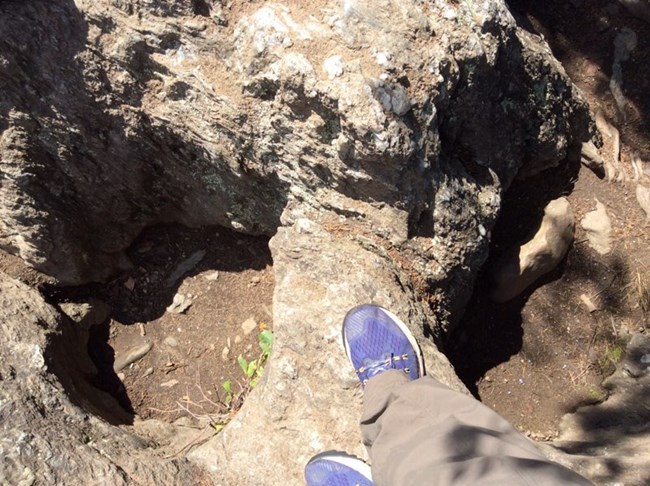 Potholes above Potomac River in relation to shoes