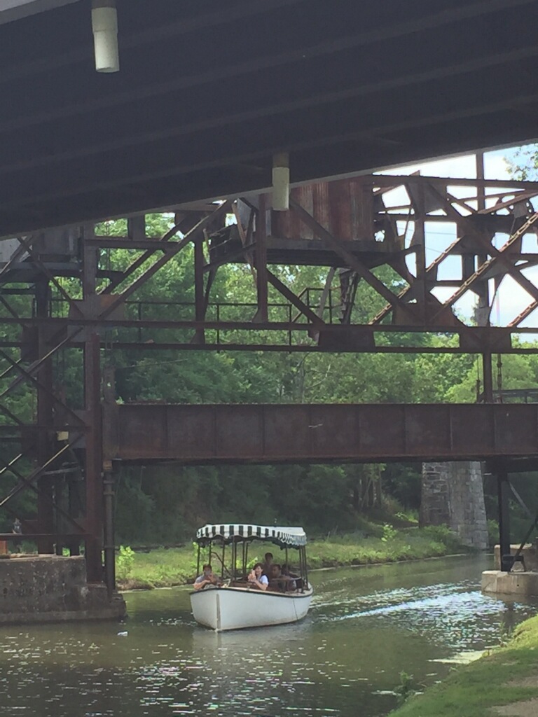 Launch Boat drives under the railroad lift bridge for the first time in 93 years.