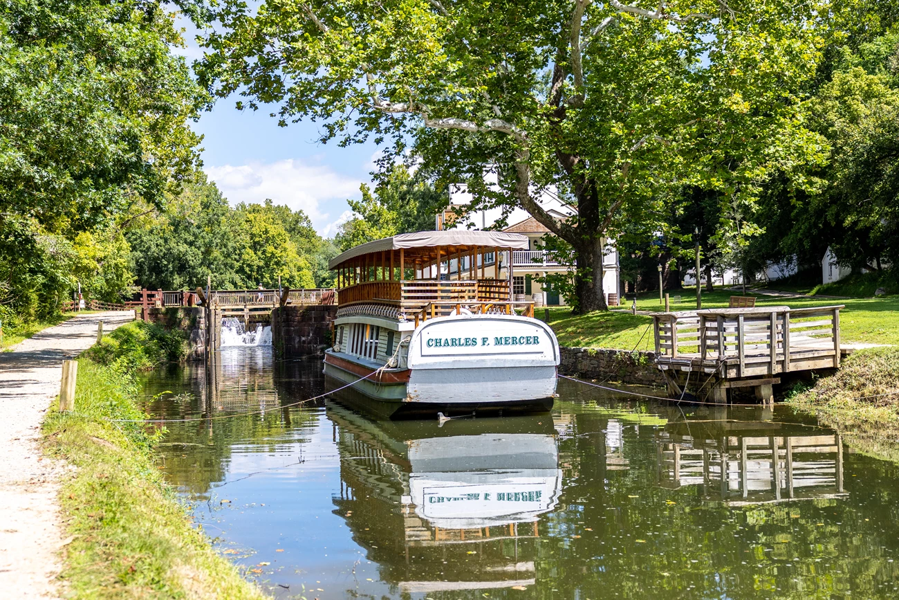 The Charles F. Mercer (NPS operated mule-drawn historic canal boat) will have increased operational capabilities at the conclusion of this project. A historic replica of a Canal Boat sits in the watered canal below Lock 20.