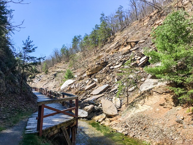 A rockslide covers the canal prism near Paw Paw Tunnel.