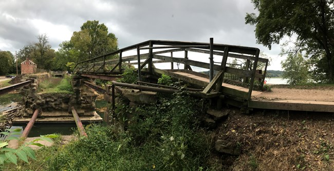 Existing timber pedestrian bridge spanning the failed west arch of the Seneca Creek Aqueduct.