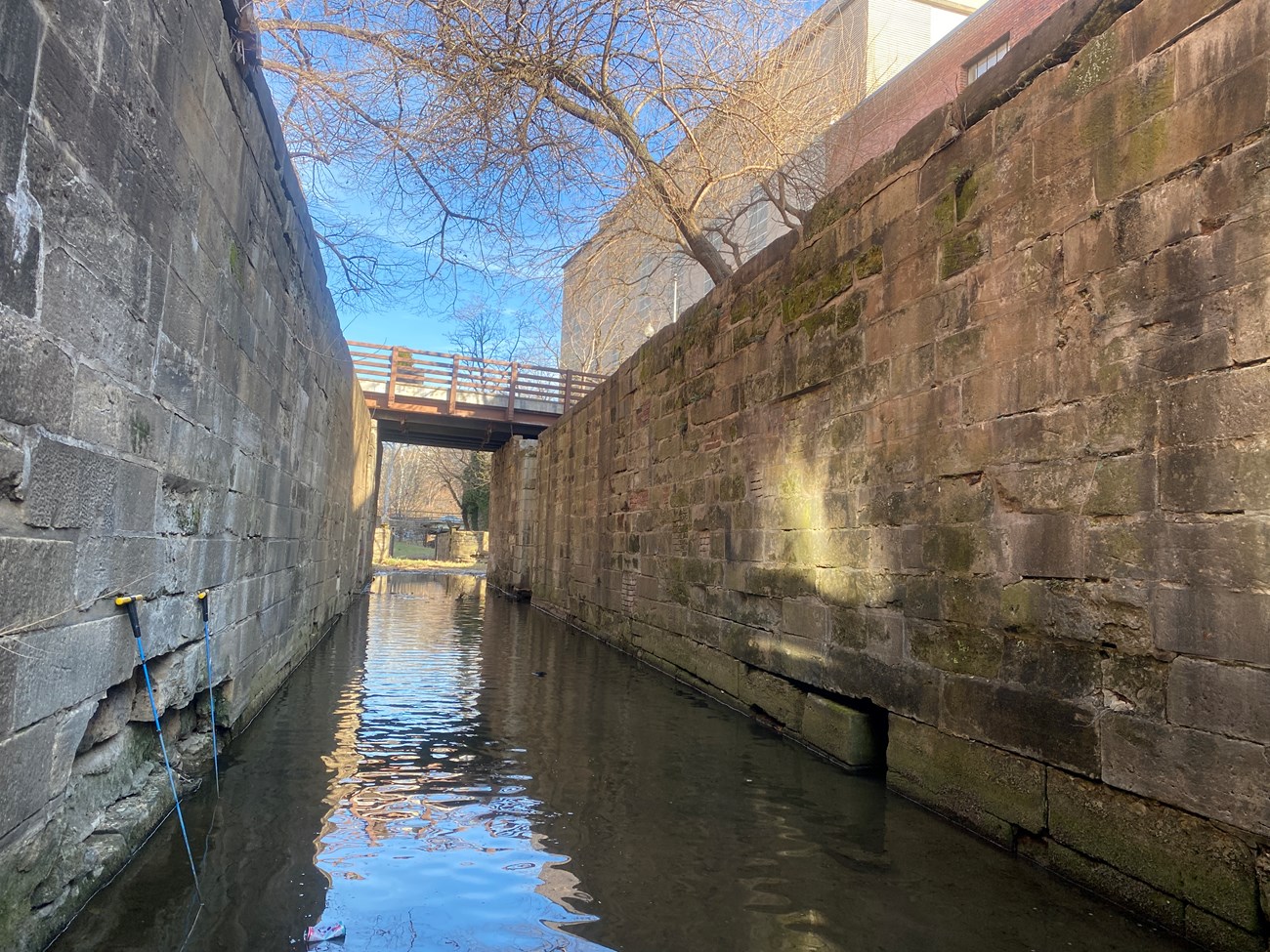 Photo from inside lock 2. There is standing water and masonry walls framing image.