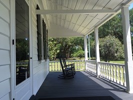 Front porch of house and rocking chairs Front porch of house and rocking chairs