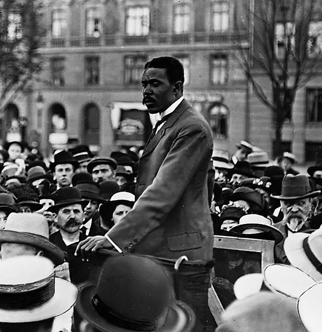 Photograph of David Hamilton Jackson speaking to a crowd in Copenhagen, Denmark.