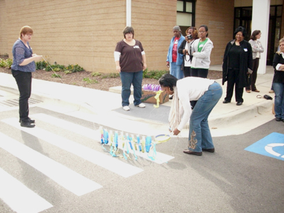 Teachers prepare to fly a kite they made as part of a hands on history lab.