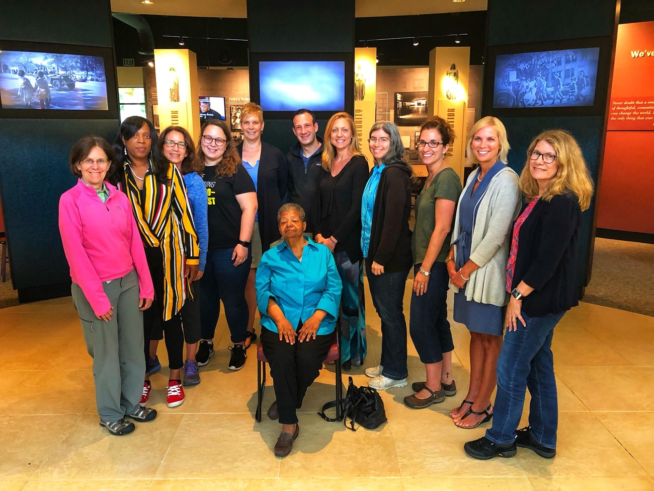 Previous Civil Rights Educator Institute participants at Little Rock Central High School NHS Visitor Center with Elizabeth Eckford, one of the Little Rock Nine.